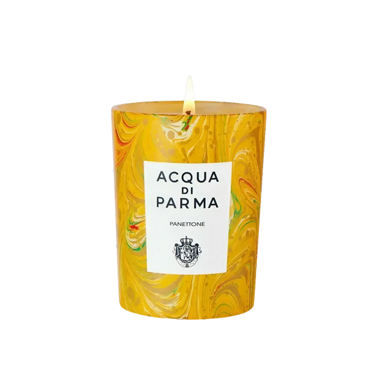 Bougie parfumée Panettone de Acqua di Parma, collection Noël, avec ambretmusc et motifs tourbillons ensoleillés