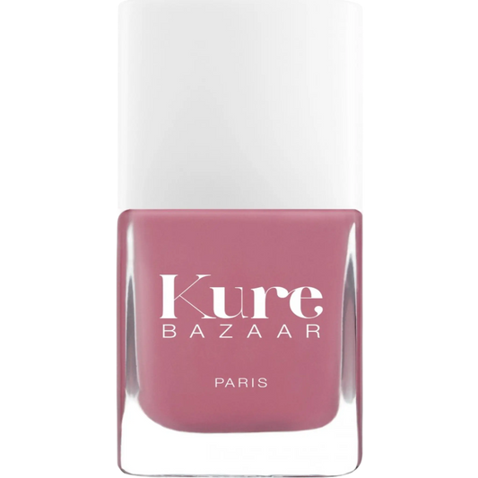 Vernis à ongles Sunset en teinte rose poudré de Kure Bazaar, collection ambretmusc, couvrance complète et écologique.