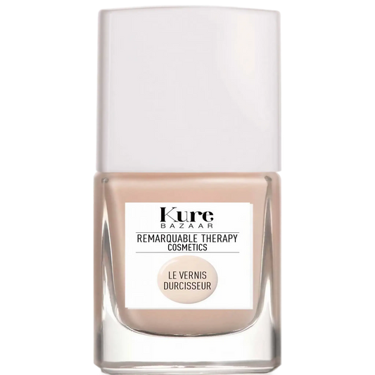 Vernis durcisseur teinté beige nude Kure Bazaar ambretmusc pour renforcer et protéger les ongles